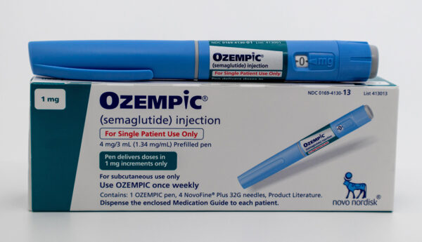 Ozempic pen and box on white background with copy space Ozempic